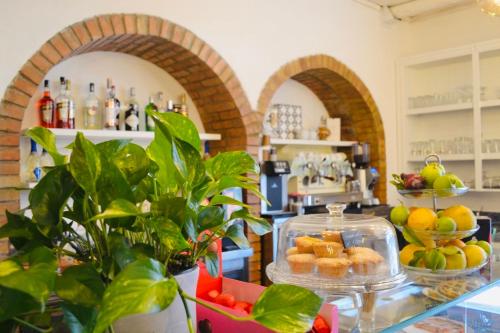 a bakery with a counter with pastries on it at B&b la bottega in Trebisacce