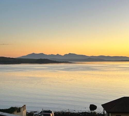a view of a body of water at sunset at View of the Isles in Largs
