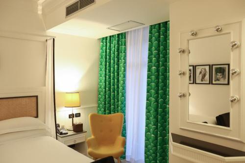 Una cama o camas en una habitación de Boutique Hotel Esplanade