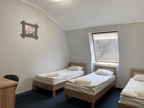 Postel nebo postele na pokoji v ubytování Budget Hotel Ekotel