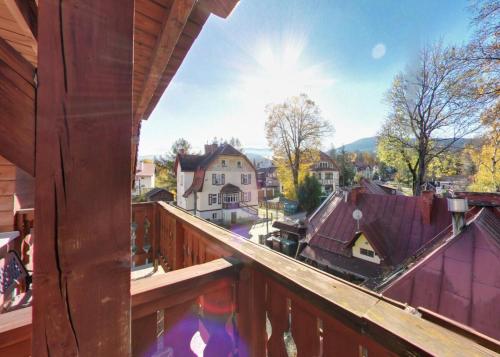 a view of a town from a balcony of a house at Dom Wypoczynkowy Topaz in Szklarska Poręba