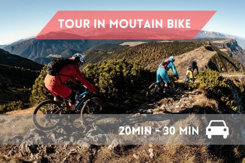 two people riding bikes on a mountain bike trail at Fuori da ZTL - Asiago a due passi da tutto in Asiago