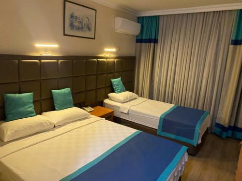 Postel nebo postele na pokoji v ubytování Prima Hotel