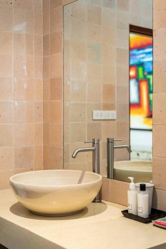 a bowl sink on a counter in a bathroom at Art Luxe Homes Chiang Mai in Doi Saket