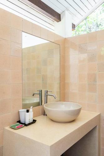 a bathroom with a large bowl sink on a counter at Art Luxe Homes Chiang Mai in Doi Saket