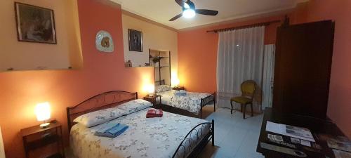 Postel nebo postele na pokoji v ubytování Le Vecchie Mura B & B