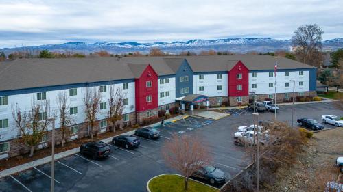 an aerial view of a building with a parking lot at Candlewood Suites Boise - Towne Square by IHG in Boise