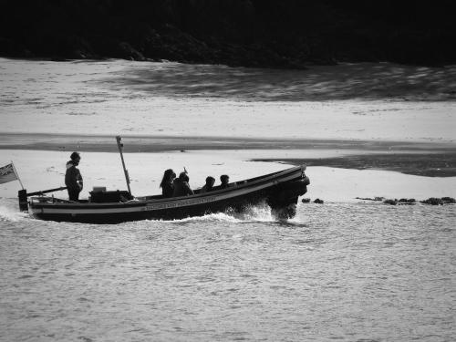 a group of people on a boat in the water at 18 Church Street in Salcombe