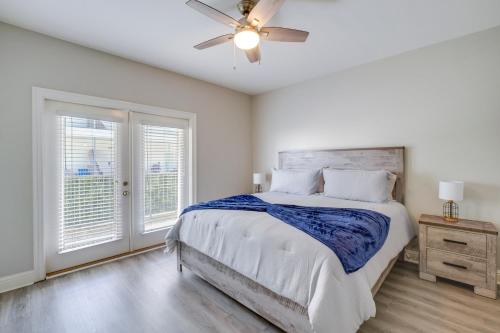 a bedroom with a bed and a ceiling fan at Relaxing Biloxi Vacation Rental Condo Near Beach! in Biloxi