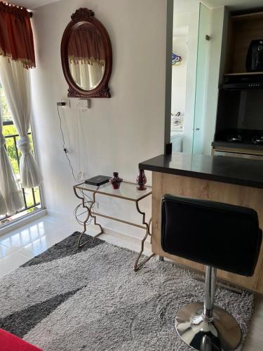 a living room with a desk and a chair at Private Room Sabaneta in Sabaneta