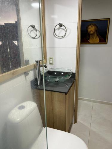 a bathroom with a sink and a toilet at Private Room Sabaneta in Sabaneta