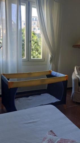 Ένα ή περισσότερα κρεβάτια σε δωμάτιο στο La Conchiglia