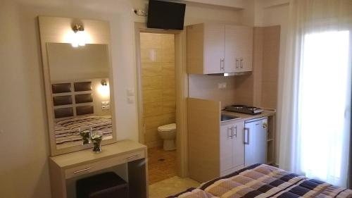 Kuchyň nebo kuchyňský kout v ubytování Gaia Studios & Apartments