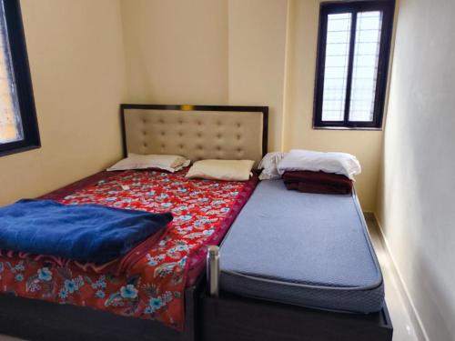 Postel nebo postele na pokoji v ubytování 1BHK Cozy Stay