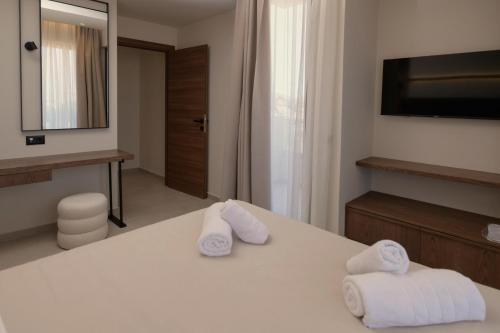 Postel nebo postele na pokoji v ubytování The Z Suites