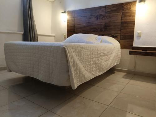 Postel nebo postele na pokoji v ubytování Hotel Rath
