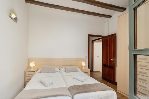 Posteľ alebo postele v izbe v ubytovaní Apartamento Francesc Samsó Girona