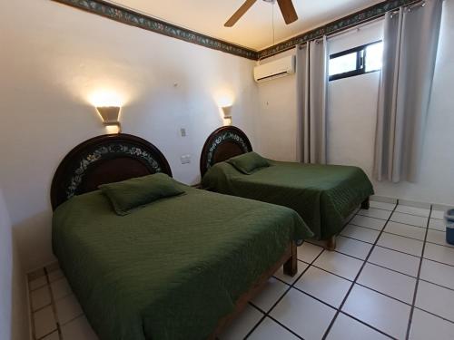 Postel nebo postele na pokoji v ubytování Hotel Rath