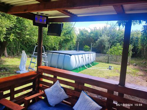 a screened in porch with a view of a gazebo at Hostal Fernanda in Santa Cruz