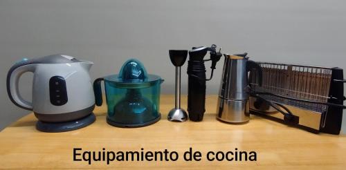a counter with various appliances on a wooden table at El Nial de Los Pinos in Ojedo