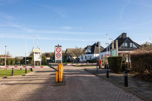 a street with a no cycling sign on a road at Tulip Beach in De Zandloper