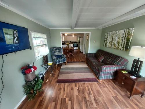 a living room with a couch and a table at St. Croix Inn in Solon Springs