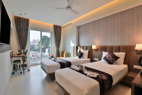 Katil atau katil-katil dalam bilik di Hotel Bawa Inn