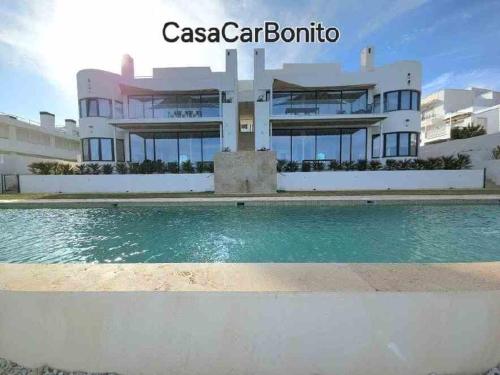 a building with a pool in front of it at CasaCarbonito in Carboneras