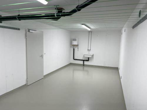 an empty room with white walls and white floors at Ferienwohnung Karrensicht in Dornbirn