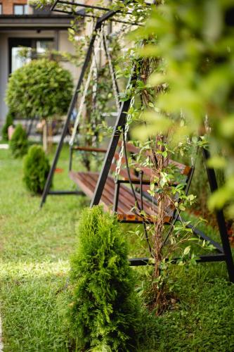 a swing set in the yard of a house at Central Inn in Kutaisi