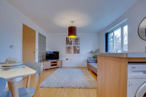 a living room with a couch and a table at Stay Yorkshire 1st floor Hamilton Mews Apartment in Doncaster