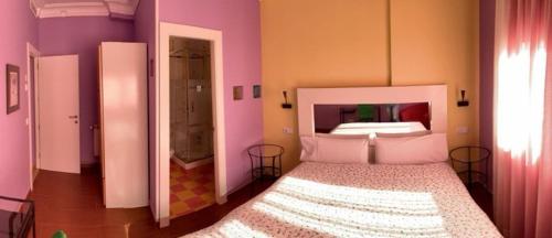Postel nebo postele na pokoji v ubytování Hostal Arco Iris