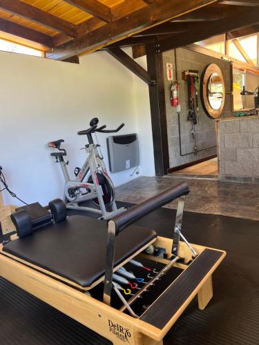 a bike on a treadmill in a room at Cabañas La Frontera in Villa General Belgrano