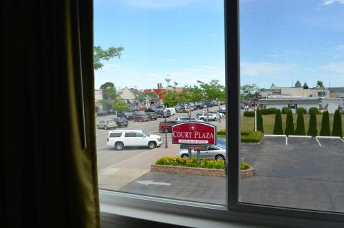 a view of a parking lot from a window at Court Plaza Inn & Suites of Mackinaw in Mackinaw City