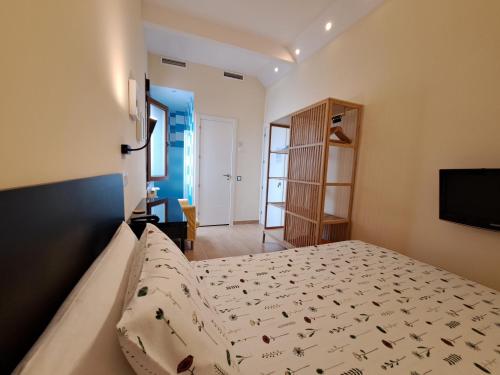 Postel nebo postele na pokoji v ubytování Hostal Arco Iris