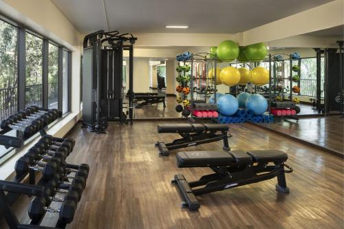 a gym with rows of dumbbells and weights at Sheraton Universal in Los Angeles