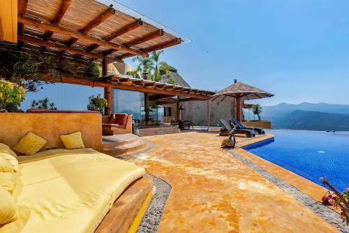 an outdoor bedroom with a bed and a swimming pool at Casa El Santuario in Valle de Bravo