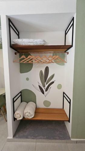 a room with two bunk beds on a wall at Solar Águas Pipa Prime in Pipa