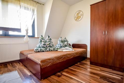 a bedroom with a bed with christmas trees on it at Marysieńka Pokoje Hrube Wyżne 12A in Zakopane