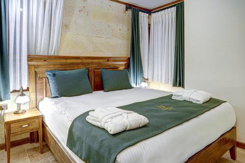 Letto o letti in una camera di Unique Cappadocia Palace