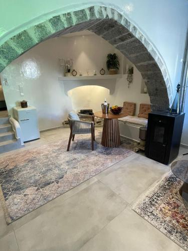 a living room with a table and a couch at Villa Benjamin in Milatos