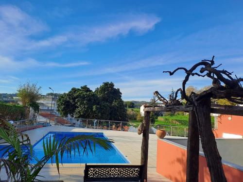 a view of a swimming pool from the balcony of a house at Vista Castelo in Sertã