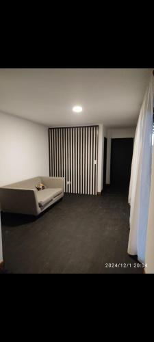 a room with a bed in the middle of a room at Poyecto Laguna in San Miguel del Monte