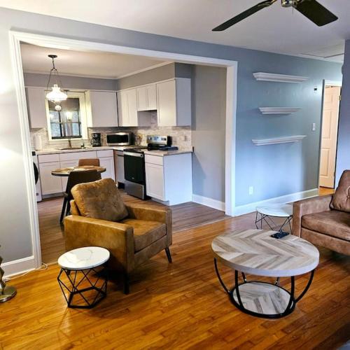 a living room with a couch and a table at Charming Charlotte city Vacation Home in Charlotte