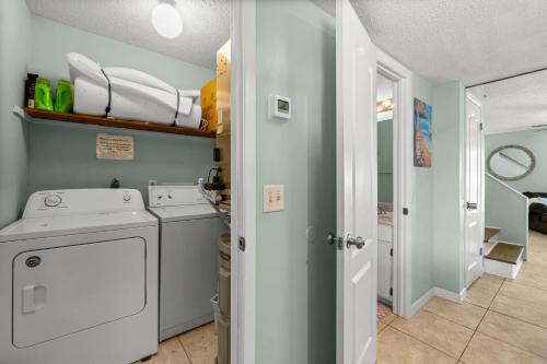 a laundry room with a washer and dryer at Biltmore Beach Townhouse! in Panama City Beach