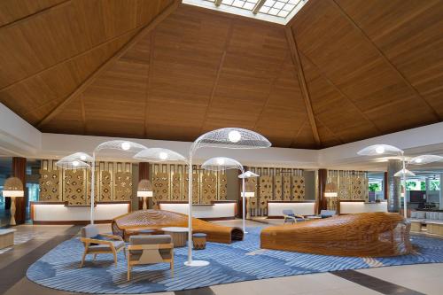 a rendering of a hotel lobby with a bed and chairs at Sheraton Fiji Golf & Beach Resort in Denarau