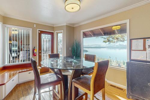 a dining room with a table and chairs and a window at The Lake Labyrinth in Zephyr Cove