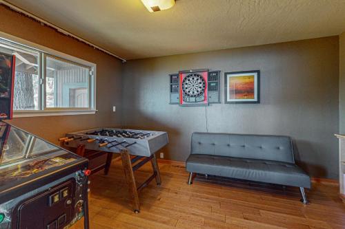 a room with a ping pong table and a bench in it at The Lake Labyrinth in Zephyr Cove
