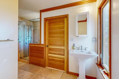 a bathroom with a sink and a shower at The Lake Labyrinth in Zephyr Cove