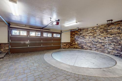 a large room with a brick wall and a basketball hoop at The Lake Labyrinth in Zephyr Cove